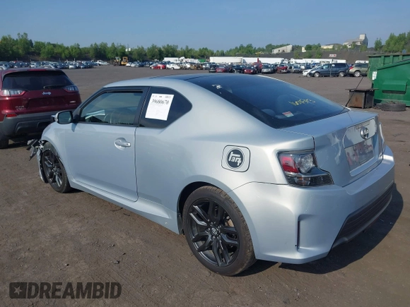 2014 Scion tC with VIN JTKJF5C78E3072572, listed as a IAAI auction lot 39680670 with 112,584 mi miles. Bid and sale history available at carsss.com. Image 3.
