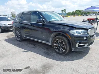 2016 BMW X5 xDrive50i with VIN 5UXKR6C51G0J81658, listed as a IAAI auction lot 41801382 with 34,572 mi miles. Bid and sale history available at carsss.com. Image 1.