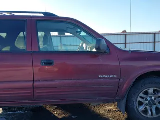 2002 Isuzu Rodeo z VIN 4S2DM58W124319936, wystawiony jako IAAI lot #41555285 z przebiegiem 143 035 mil mil oraz . Historia ofert i sprzedaży dostępna na DreamBid. Obrazek 13.