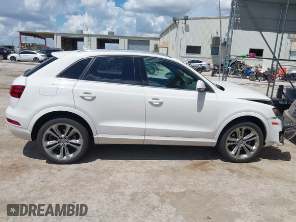 2015 Audi Q3 Prestige with VIN WA1GFCFS1FR007092, listed as a IAAI auction lot 42588730 with 85,290 mi miles and . Bid and sale history available at DreamBid. Image 13.