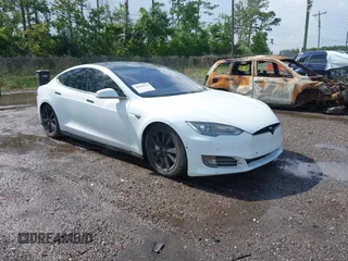 2014 Tesla Model S 60 with VIN 5YJSA1H1XEFP40611, listed as a IAAI auction lot 42826752 with Not provided miles and . Bid and sale history available at DreamBid. Image 1.