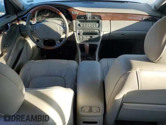 2003 Cadillac DeVille DTS z VIN 1G6KF57963U257494, wystawiony jako Copart lot #84532944 z przebiegiem 104 766 mil mil oraz Szkoda całkowita • Salvage title. Historia ofert i sprzedaży dostępna na DreamBid. Obrazek 8.