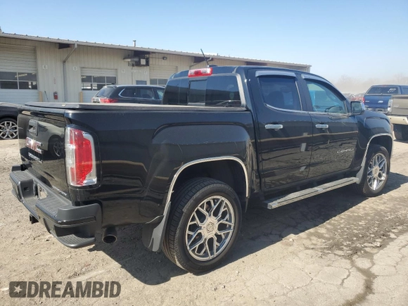 2021 GMC Canyon 4WD Denali with VIN 1GTG6EEN4M1221938, listed as a Copart auction lot 48760965 with 63,231 mi miles and Salvage Title. Bid and sale history available at carsss.com. Image 3.
