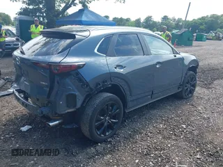 2023 Mazda CX-30 S Preferred z VIN 3MVDMBCM4PM558181, wystawiony jako IAAI lot #42589333 z przebiegiem 12 384 mil mil oraz . Historia ofert i sprzedaży dostępna na DreamBid. Obrazek 4.