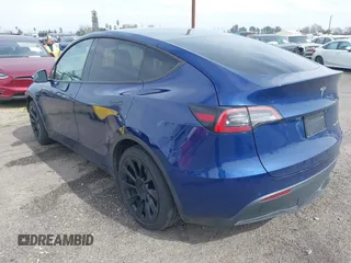 2021 Tesla Model Y Long Range with VIN 5YJYGAEE5MF199286, listed as a IAAI auction lot 41677915 with 52,500 mi miles. Bid and sale history available at carsss.com. Image 3.