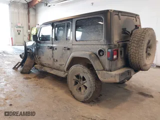 2020 Jeep Wrangler Unlimited Sport Altitude with VIN 1C4HJXDG4LW120627, listed as a IAAI auction lot 41728593 with 63,565 mi miles. Bid and sale history available at carsss.com. Image 3.