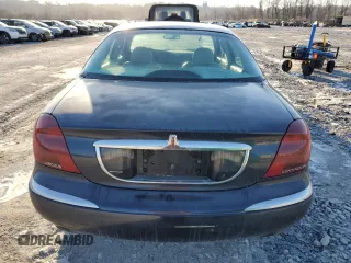 1999 Lincoln Continental with VIN 1LNHM97V2XY719495, listed as a Copart auction lot 42239665 with 234,544 mi miles and Salvage Title. Bid and sale history available at carsss.com. Image 6.
