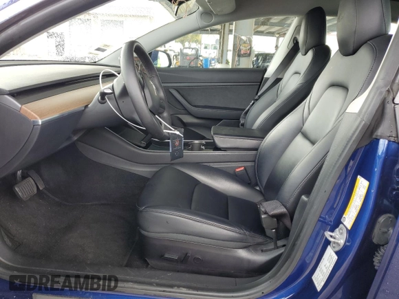 2020 Tesla Model 3 Standard Range Plus with VIN 5YJ3E1EA1LF631139, listed as a Copart auction lot 49161805 with 58,140 mi miles and Salvage Title. Bid and sale history available at DreamBid. Image 7.