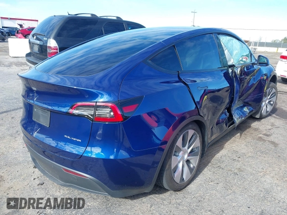 2022 Tesla Model Y Long Range with VIN 7SAYGDEE6NF318372, listed as a IAAI auction lot 41526857 with 26,083 mi miles and . Bid and sale history available at carsss.com. Image 4.
