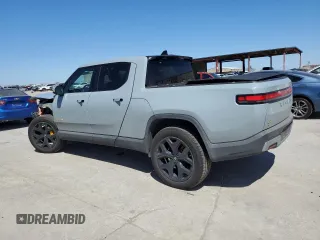 2022 Rivian R1T Adventure z VIN 7FCTGAAAXNN014983, wystawiony jako Copart lot #48987605 z przebiegiem Nie podano mil oraz Szkoda całkowita • Salvage title. Historia ofert i sprzedaży dostępna na DreamBid. Obrazek 2.