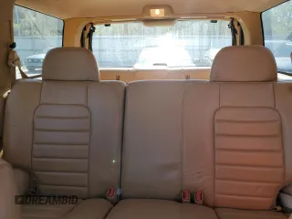 1998 Jeep Grand Cherokee with VIN 1J4FX48S8WC281615, listed as a Copart auction lot 77305594 with 128,393 mi miles and Salvage title. Bid and sale history available at DreamBid. Image 10.