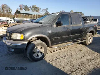 2003 Ford F-150 XLT with VIN 1FTRW08623KD45425, listed as a Copart auction lot 77605404 with 174,369 mi miles and Salvage Title. Bid and sale history available at carsss.com. Image 1.