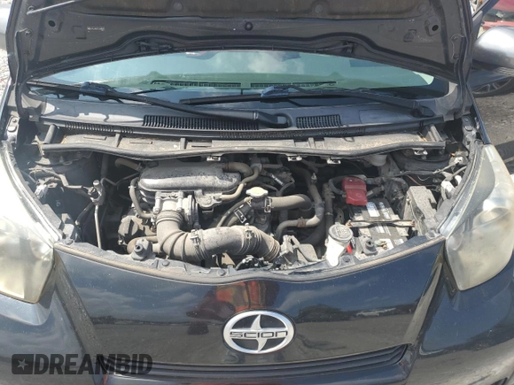 2014 Scion iQ with VIN JTNJJXB07EJ028558, listed as a Copart auction lot 64745345 with 112,221 mi miles and Clean title. Bid and sale history available at DreamBid. Image 11.