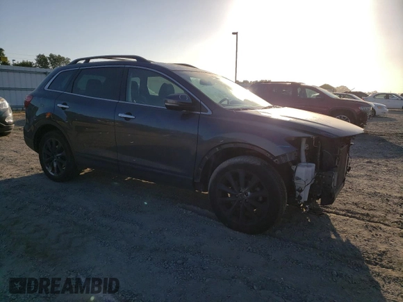 2015 Mazda CX-9 Grand Touring z VIN JM3TB3DV2F0456130, wystawiony jako Copart lot #60545095 z przebiegiem 120 892 mil mil oraz Szkoda całkowita • Salvage title. Historia ofert i sprzedaży dostępna na DreamBid. Obrazek 4.