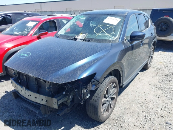 2023 Mazda CX-5 S Premium with VIN JM3KFBDM4P0185865, listed as a IAAI auction lot 42040234 with 32,761 mi miles and . Bid and sale history available at DreamBid. Image 20.