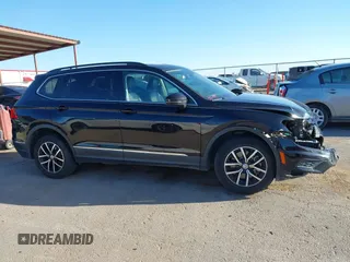2021 Volkswagen Tiguan SE z VIN 3VV3B7AX0MM080853, wystawiony jako IAAI lot #42406539 z przebiegiem 73 295 mil mil oraz . Historia ofert i sprzedaży dostępna na DreamBid. Obrazek 14.