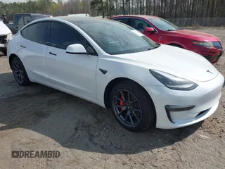 2022 Tesla Model 3 with VIN 5YJ3E1EA5NF124148, listed as a IAAI auction lot 41908884 with 45,115 mi miles. Bid and sale history available at carsss.com. Image 1.