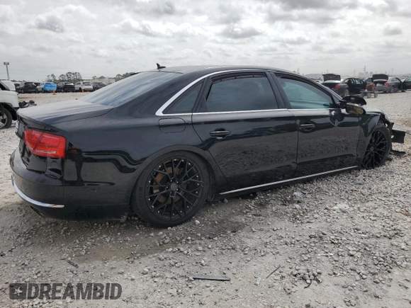 2014 Audi A8 3.0T z VIN WAURGAFD2EN002567, wystawiony jako Copart lot #48188395 z przebiegiem 159 477 mil mil oraz Szkody całkowita. Historia ofert i sprzedaży dostępna na DreamBid. Obrazek 3.