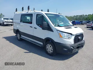 2021 Ford Transit Cargo z VIN 1FTBR1Y81MKA26244, wystawiony jako IAAI lot #42150873 z przebiegiem 74 562 mil mil oraz . Historia ofert i sprzedaży dostępna na DreamBid. Obrazek 1.