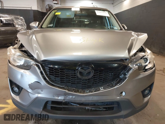 2014 Mazda CX-5 Grand Touring with VIN JM3KE4DY9E0373974, listed as a IAAI auction lot 42073693 with 86,755 mi miles. Bid and sale history available at carsss.com. Image 12.