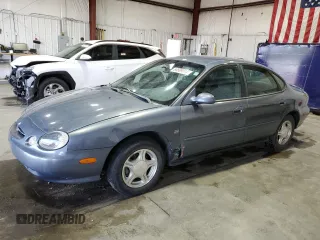 1999 Ford Taurus SE z VIN 1FAFP53S6XG145003, wystawiony jako Copart lot #66869014 z przebiegiem 120 861 mil mil oraz Tytuł czysty. Historia ofert i sprzedaży dostępna na DreamBid. Obrazek 1.