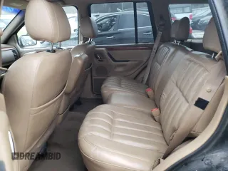 1999 Jeep Grand Cherokee Limited with VIN 1J4GW68SXXC713416, listed as a Copart auction lot 88296395 with 0 mi miles and Non Repairable. Bid and sale history available at carsss.com. Image 10.