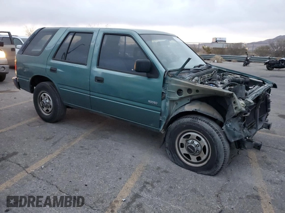 1996 Isuzu Rodeo z VIN 4S2CK58E1T4331031, wystawiony jako Copart lot #78573514 z przebiegiem 218 994 mil mil oraz Szkody całkowita. Historia ofert i sprzedaży dostępna na DreamBid. Obrazek 4.