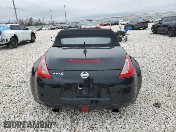 2014 Nissan 370Z Touring with VIN JN1AZ4FH1EM620177, listed as a Copart auction lot 42581255 with 106,957 mi miles and Salvage Title. Bid and sale history available at DreamBid. Image 6.