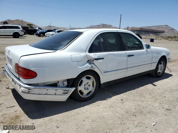 1999 Mercedes-Benz E-Class with VIN WDBJF70H5XA831773, listed as a Copart auction lot 71320244 with 145,181 mi miles and Salvage Title. Bid and sale history available at carsss.com. Image 3.