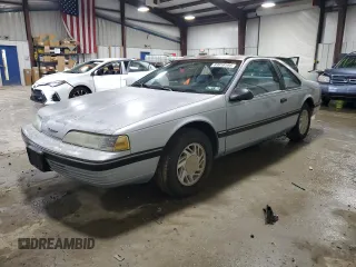 1990 Ford Thunderbird with VIN 1FAPP6047LH140817, listed as a Copart auction lot 83910194 with 177,909 mi miles and Salvage Title. Bid and sale history available at DreamBid. Image 1.