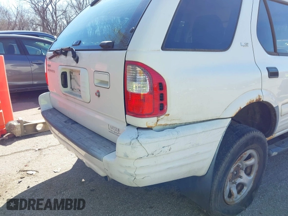 2002 Isuzu Rodeo z VIN 4S2DM58W624304459, wystawiony jako IAAI lot #41853398 z przebiegiem 169 313 mil mil oraz . Historia ofert i sprzedaży dostępna na DreamBid. Obrazek 6.