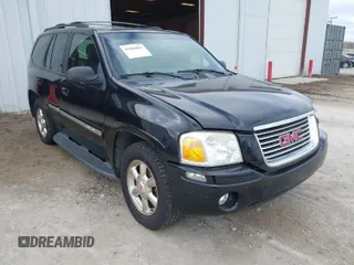 2002 GMC Envoy SLT with VIN 1GKDT13S622506181, listed as a IAAI auction lot 41986061 with 212,583 mi miles. Bid and sale history available at carsss.com. Image 1.