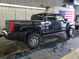 2009 Hummer H3 with VIN 5GNEN13EX98140981, listed as a Copart auction lot 87460374 with 111,362 mi miles and Salvage Title. Bid and sale history available at DreamBid. Image 3.