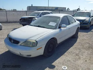 2003 Mercury Sable GS with VIN 1MEFM50U33A629599, listed as a IAAI auction lot 41579245 with 128,198 mi miles. Bid and sale history available at carsss.com. Image 2.