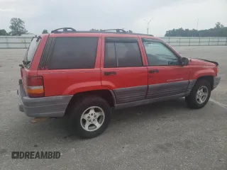 1998 Jeep Grand Cherokee Laredo with VIN 1J4FX58S3WC144684, listed as a Copart auction lot 67226694 with 106,602 mi miles and Clean Title. Bid and sale history available at carsss.com. Image 3.