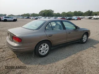 2000 Oldsmobile Intrigue GL z VIN 1G3WS52H4YF210758, wystawiony jako Copart lot #70872454 z przebiegiem 103 298 mil mil oraz Tytuł czysty. Historia ofert i sprzedaży dostępna na DreamBid. Obrazek 3.