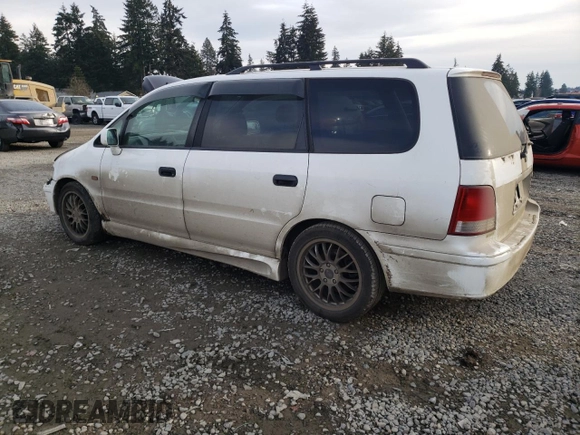 1998 Honda Odyssey with VIN RA31038664, listed as a Copart auction lot 43051785 with 106,084 mi miles and Salvage title. Bid and sale history available at DreamBid. Image 2.