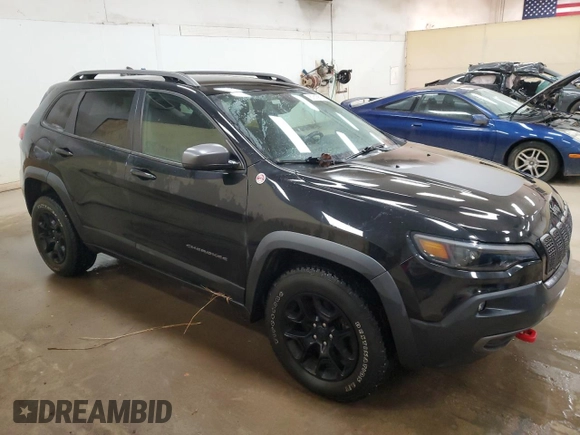 2019 Jeep Cherokee Trailhawk Elite with VIN 1C4PJMBX2KD227246, listed as a Copart auction lot 87815615 with 88,636 mi miles and Salvage Title. Bid and sale history available at carsss.com. Image 4.