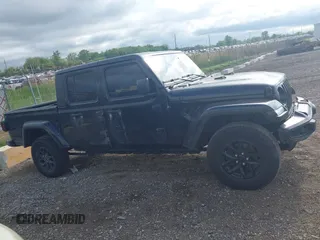 2022 Jeep Gladiator Texas Trail with VIN 1C6HJTAG7NL125006, listed as a IAAI auction lot 42288180 with 96,694 mi miles and . Bid and sale history available at DreamBid. Image 13.