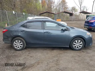 2015 Toyota Corolla L with VIN 2T1BURHE2FC349953, listed as a IAAI auction lot 42001672 with 104,776 mi miles and . Bid and sale history available at DreamBid. Image 13.