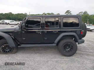 2021 Jeep Wrangler Unlimited Willys z VIN 1C4HJXDM5MW859724, wystawiony jako IAAI lot #42311203 z przebiegiem 71 887 mil mil oraz . Historia ofert i sprzedaży dostępna na DreamBid. Obrazek 14.