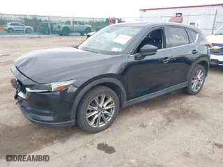 2021 Mazda CX-5 Grand Touring with VIN JM3KFBDMXM0456939, listed as a IAAI auction lot 40901055 with 113,540 mi miles. Bid and sale history available at carsss.com. Image 2.