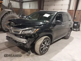 2020 Honda Pilot Touring 7-Passenger with VIN 5FNYF6H63LB032301, listed as a IAAI auction lot 38419333 with 50,433 mi miles and . Bid and sale history available at carsss.com. Image 18.