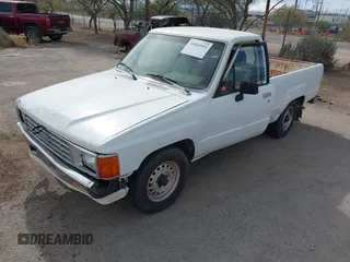 1991 Toyota Pickup DX z VIN JT4RN81P8M5123864, wystawiony jako IAAI lot #38084991 z przebiegiem 319 627 mil mil oraz . Historia ofert i sprzedaży dostępna na DreamBid. Obrazek 2.