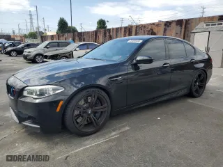 2015 BMW M5 with VIN WBSFV9C56FD594465, listed as a Copart auction lot 72085944 with 76,313 mi miles and Salvage Title. Bid and sale history available at carsss.com. Image 1.