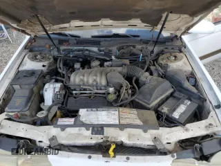 1992 Ford Taurus GL z VIN 1FALP52U5NA280821, wystawiony jako Copart lot #77457304 z przebiegiem 33 484 mil mil oraz Szkoda całkowita • Salvage title. Historia ofert i sprzedaży dostępna na DreamBid. Obrazek 11.