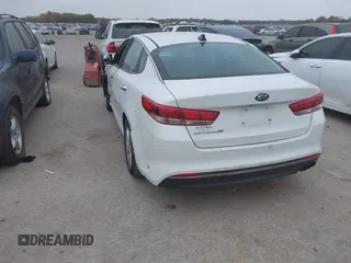 2016 Kia Optima LX with VIN KNAGT4L39G5104726, listed as a IAAI auction lot 40950914 with 128,728 mi miles. Bid and sale history available at carsss.com. Image 3.