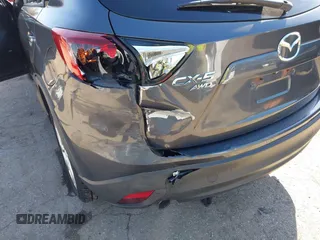 2014 Mazda CX-5 Grand Touring with VIN JM3KE4DY4E0320695, listed as a IAAI auction lot 41989350 with 169,391 mi miles and . Bid and sale history available at DreamBid. Image 6.