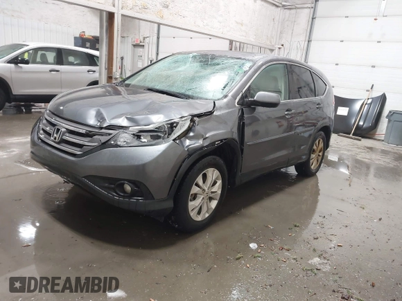 2013 Honda CR-V EX with VIN 2HKRM4H59DH682484, listed as a IAAI auction lot 41504589 with 208,260 mi miles and . Bid and sale history available at DreamBid. Image 2.