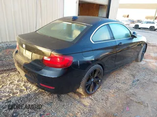 2015 BMW 2 Series 228i with VIN WBA1F5C55FV256604, listed as a IAAI auction lot 41841754 with 118,354 mi miles. Bid and sale history available at carsss.com. Image 4.